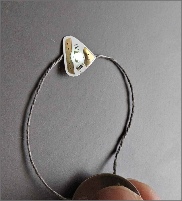 a LED light in a switch state (user presses it to turn on)