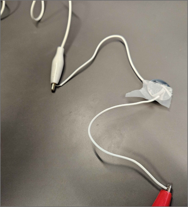 finding ways to power lights using aligator clips, light and small conductive wires