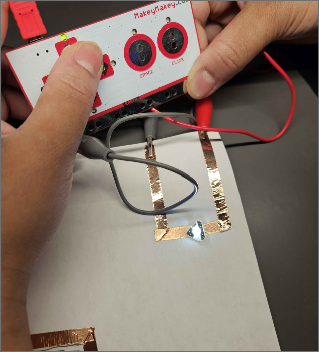 a well lit LED light by grounding the user and pressing the button